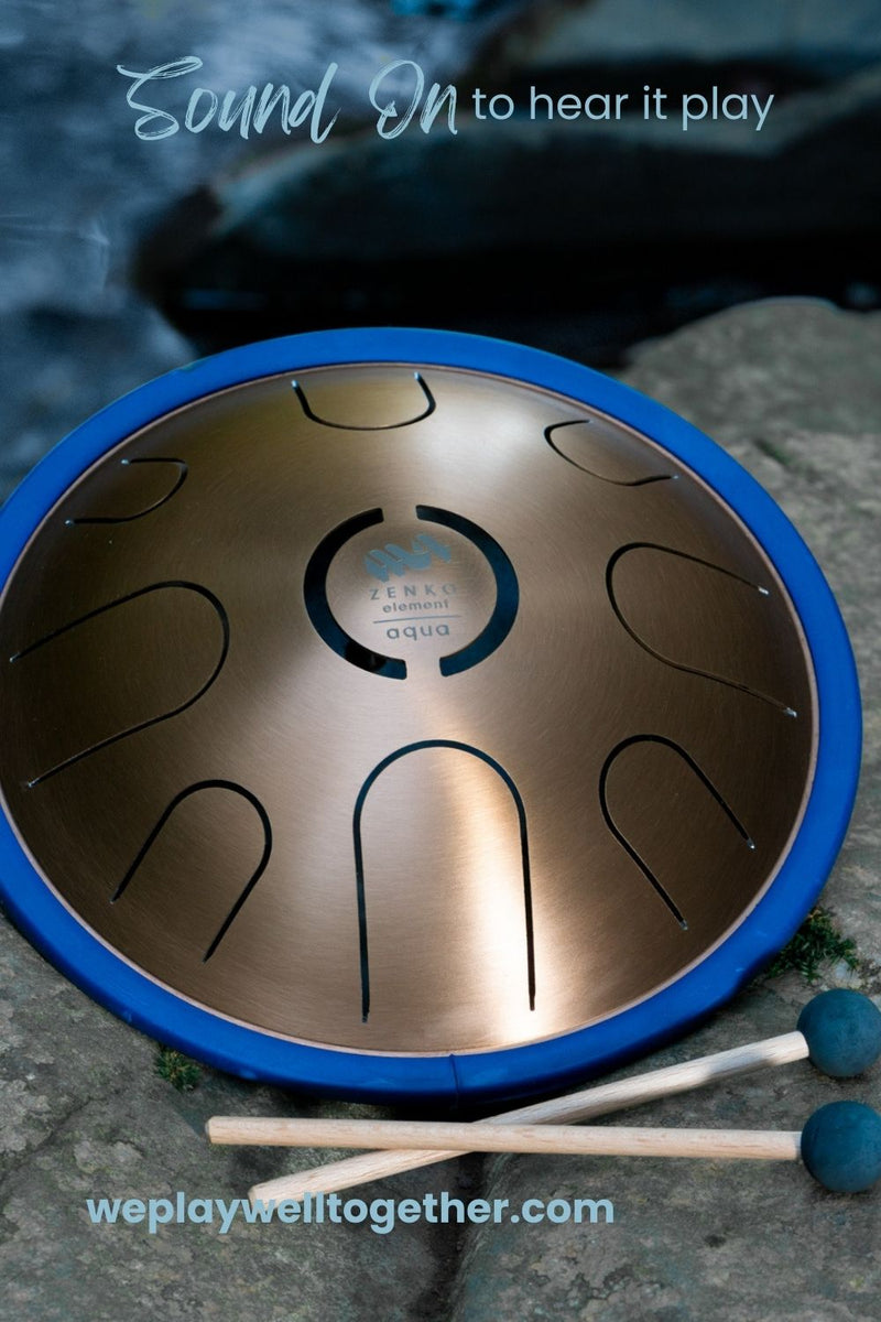 Zenko elemental metal tongue drum in Aqua tuning with mallets by the water | weplaywelltogether