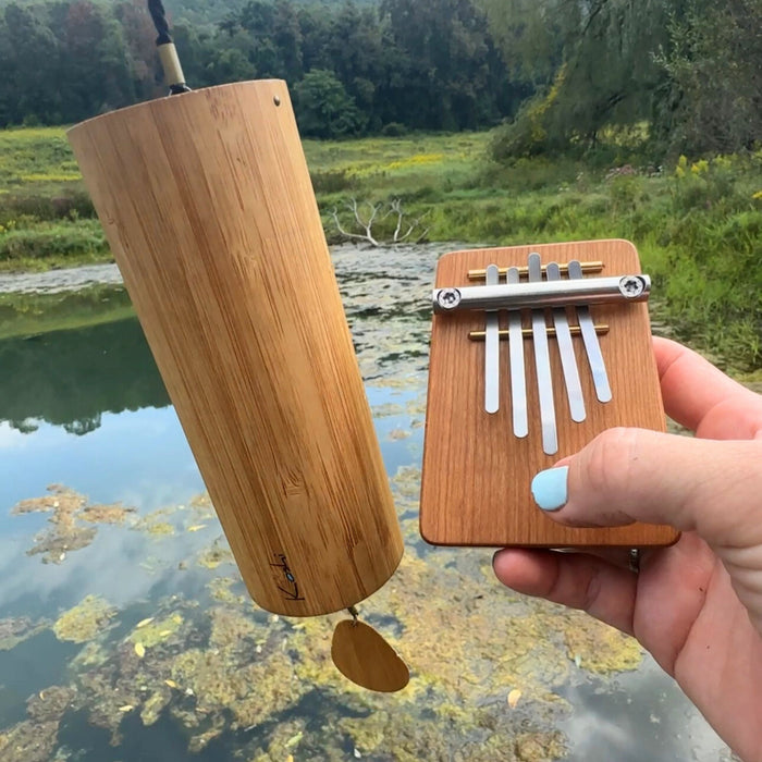 Twinkle set Hokema Kalimba B5 and Koshi Chime Aqua part of the Elemental Soundscapes set D-minor |weplaywelltogether a koshi Chime and a Kalimba in front of a lake