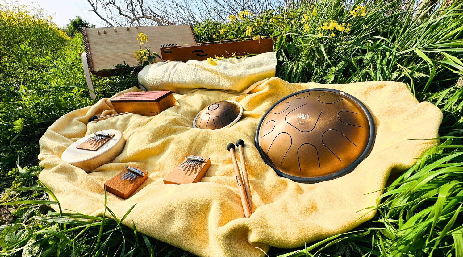 feeltone monochords and Tinka Tong (a wooden tongue drum), Zenko metal tongue drums with mallets, Hokema Sansula Deluxe, B9 and B5 kalimbas | weplaywelltogether