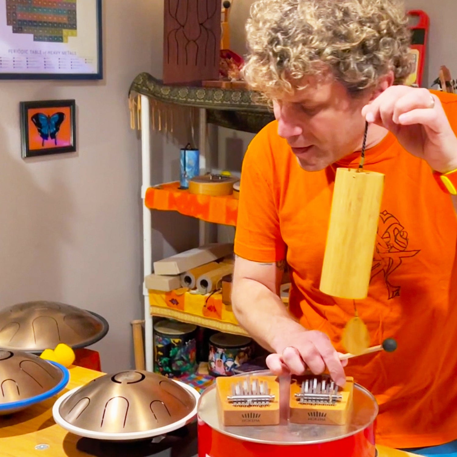 Brandon Blake, a musician and teacher playing hokema kalimbas while holding Koshi chime. | weplaywelltogether