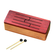 feeltone Tinka Tong drum in front of water with the logo visible |weplaywelltogether