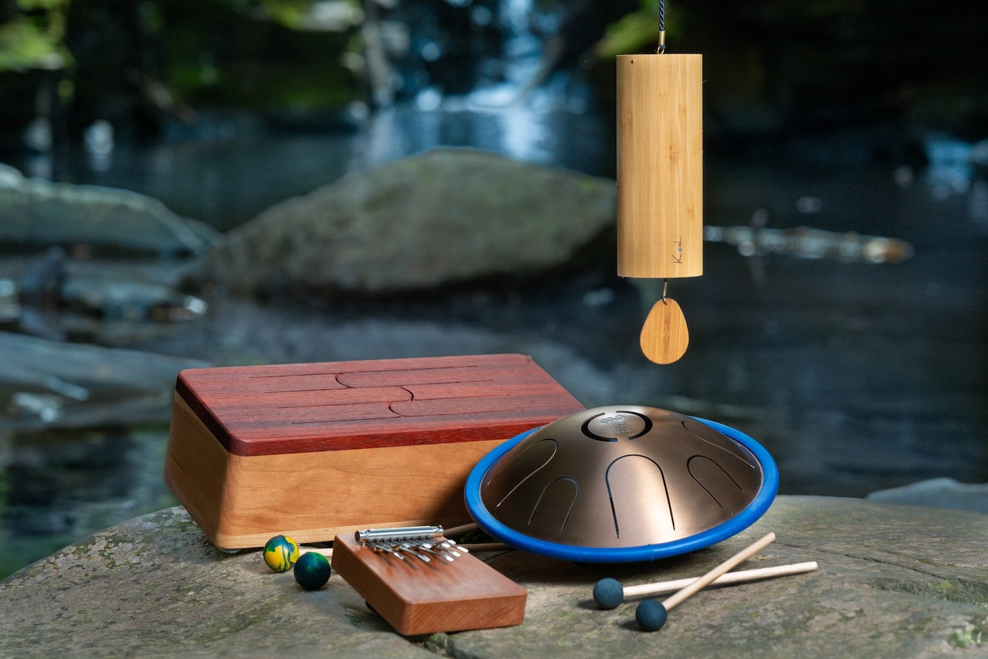 Set of We Play Well Together instruments tuned in to Aqua / Water - Hokema kalimba, Elemental Aqua metal Zenko tongue drum by Metal Sounds,  Elemental wooden tongue drum Aqua by feeltone and Koshi chime Aqua. | weplaywelltogether