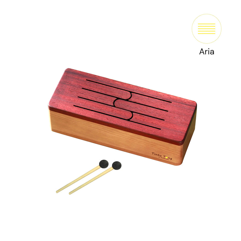 a wooden tongue drum - tinka tong Aria with mallets by feeltone | weplaywelltogether