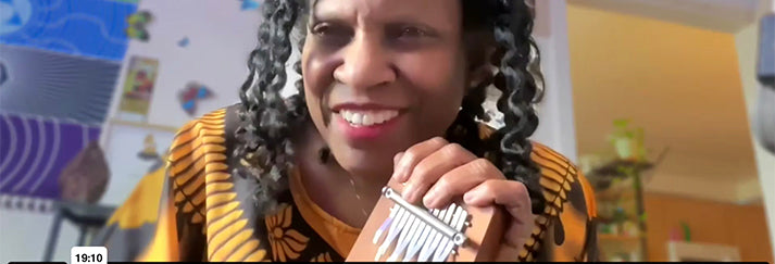 Robbi K rocks the beat on her kalimbas