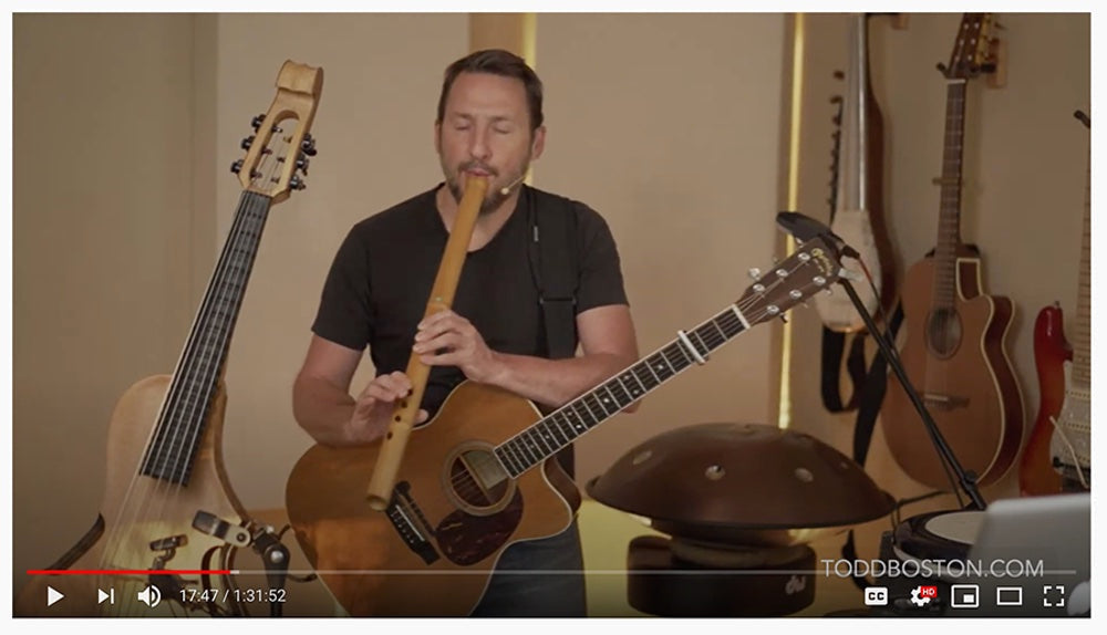 Award-winning multi-instrumentalist Todd Boston in a forest setting