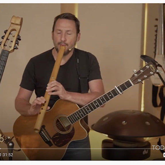 Award-winning multi-instrumentalist Todd Boston in a forest setting