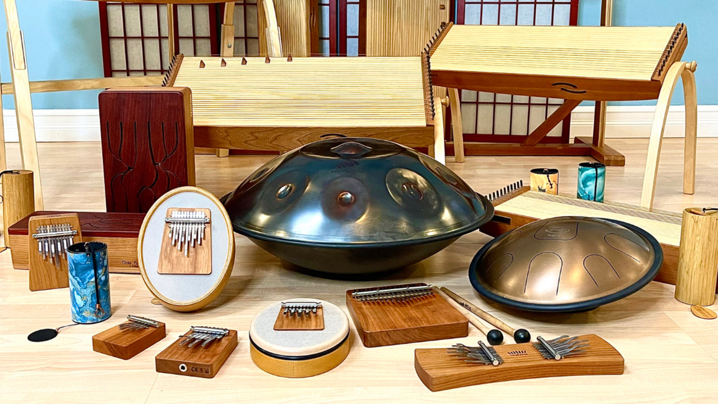 All WePlayWelltogether instruments showcased in the photo including spacedrum by Metal Sounds, Zenko metal tongue drum, wooden tongue drums, Hokema kalimbas, feeltone monochords and chimes from Koshi and Zaphir. | weplaywelltogether