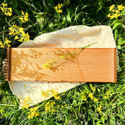 feeltone Monolini monochord by the field with flowers | weplaywelltogether