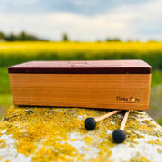 feetone Tinka Tong tongue drum in Air tuning with mallets by the field | weplaywelltogether