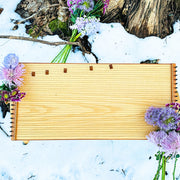 feeltone Monolina in snow with flowers | weplaywelltogether