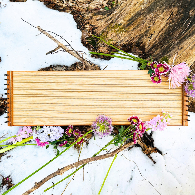 feeltone monolini in a snow with flowers | weplaywelltogether