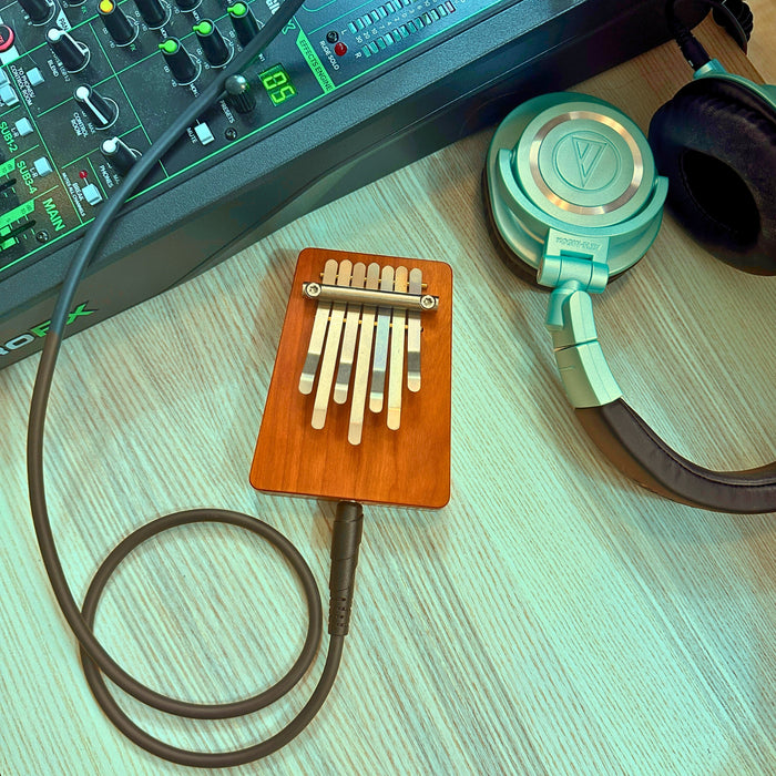 Hokema B7 electro kalimba with cables and headphones | weplaywelltogether