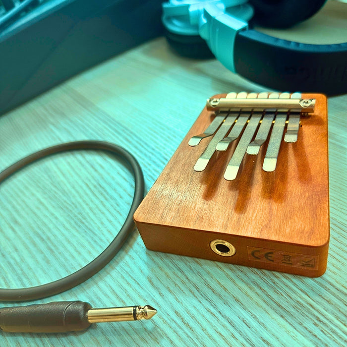 Hokema B7 electro kalimba with cables and headphones | weplaywelltogether