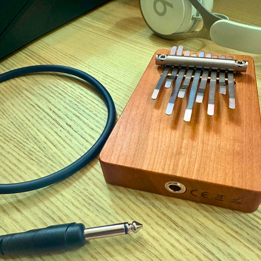 Hokema B9 elecktro kalimba with cables and headphones | weplaywelltogether