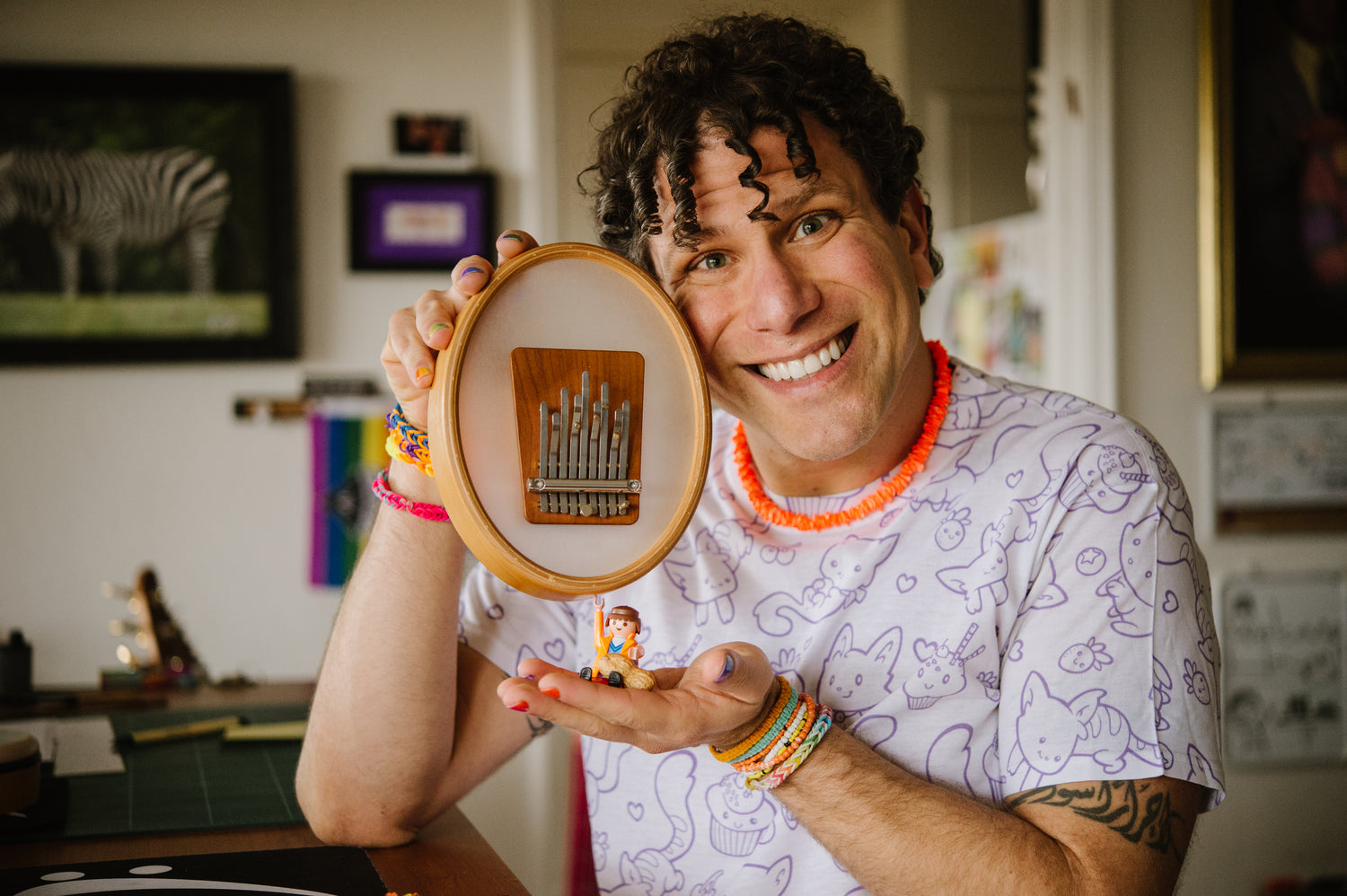 Brandon Blake, a musician and teacher holding Hokema Sansula kalimba. | weplaywelltogether