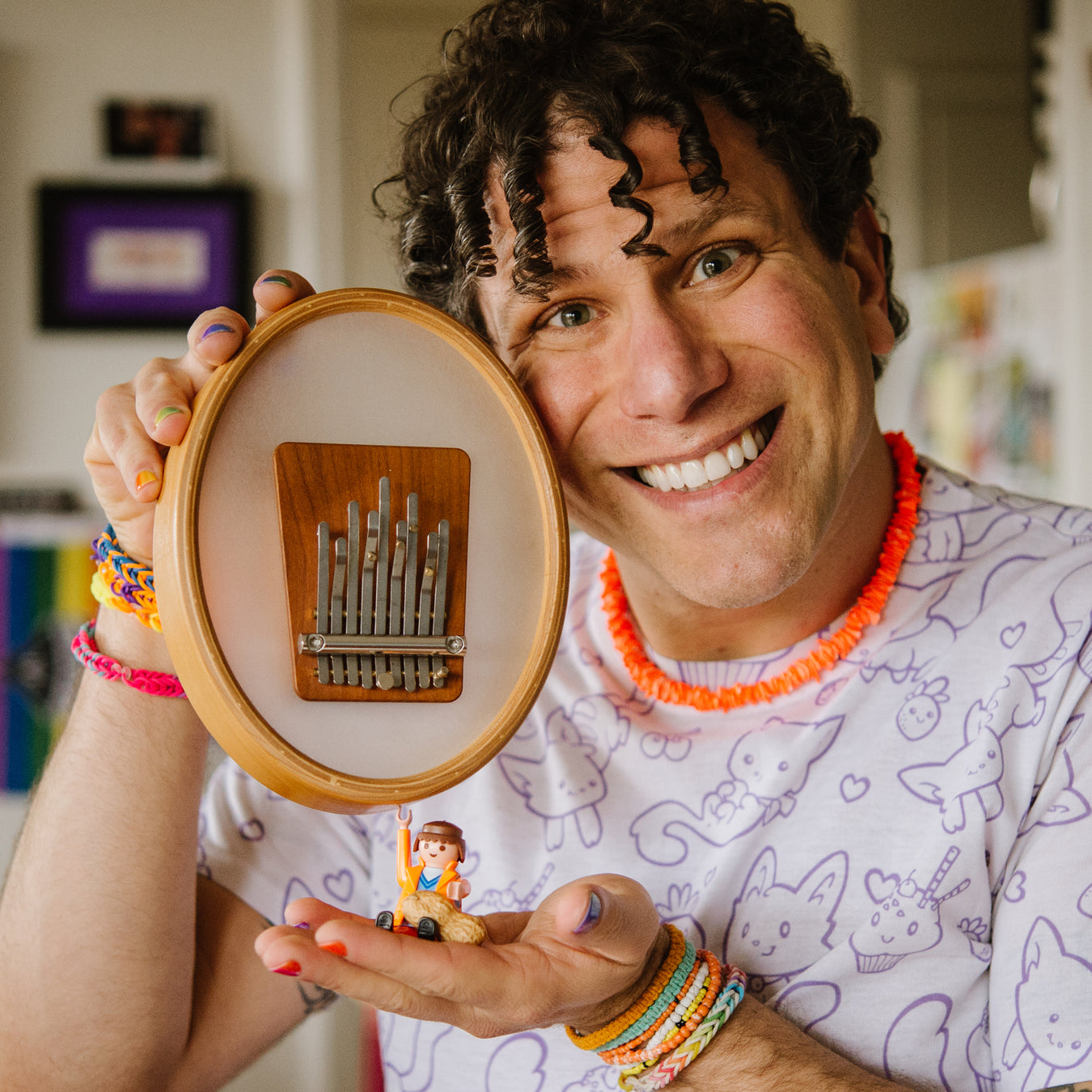 Musician and teacher Brandon Blake showing Hokema Sansula Renaissance, a kalimba where the wooden block with tines sit in the middle of drum head. | weplaywelltogether