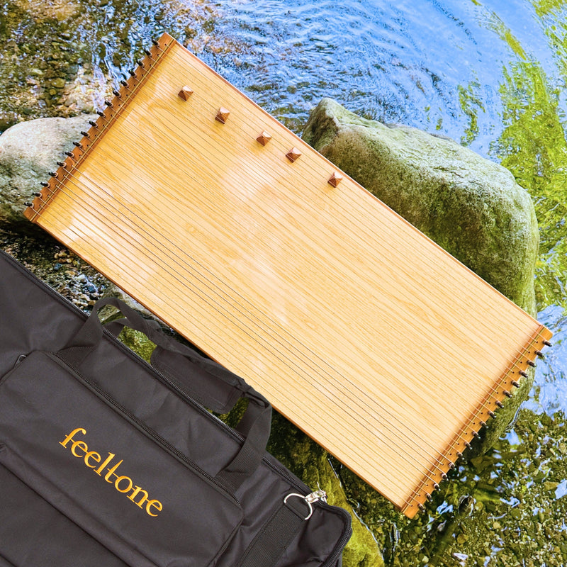 feeltone Monolina Monochord and carrying case by the water | weplaywelltogether