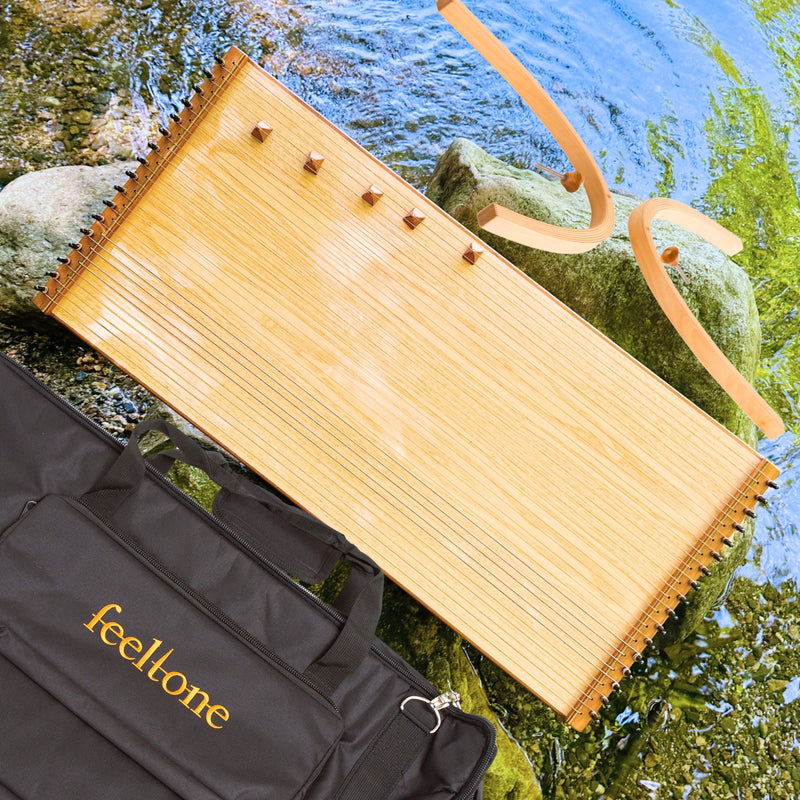 feeltone Monolina Monochord, stand and carrying case by the water | weplaywelltogether