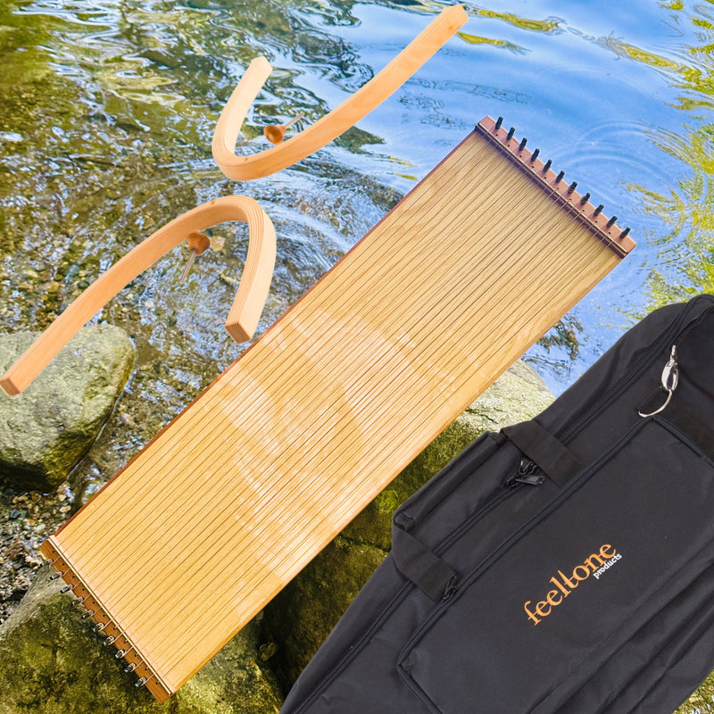 feeltone Monolini Monochord, stand and carrying case by the water | weplaywelltogether