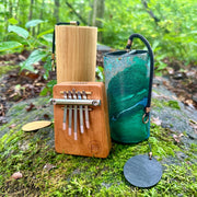 Hokema B5 kalimba with green Zaphir and Koshi Terra chimes in nature  | weplaywelltogether