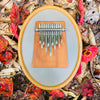 Hokema Sansula Renaissance kalimba with fall leafs | weplaywelltogether
