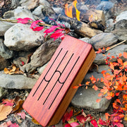 feetone Tinka Tong tongue drum in Fire tuning with mallets by the rocks | weplaywelltogether