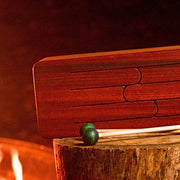 feetone Tinka Tong tongue drum in Fire tuning with mallets by the fire | weplaywelltogether
