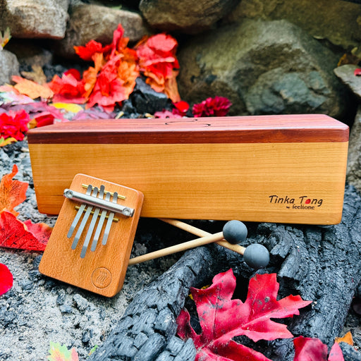 feeltone Fire Tinka Tong, a wooden tonbue drum with mallets and Hokema B5 fire kalimba | weplaywelltogether