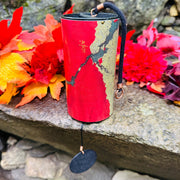 Red Zaphir chime at the rock with fall leafs | weplaywelltogether