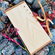 feeltone Monolina Monochord and stand by the rocks | weplaywelltogether