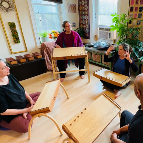 group of people playing feeltone monochords | weplaywelltogether
