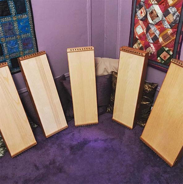 multiple feeltone monochords leaning against a wall  | weplaywelltogether