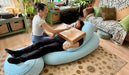 a person playing feeltone monochord on top of another person | weplaywelltogether