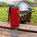 red  colored Zaphir chime  sitting on a balustrade in front of a fire pit with clouds of smoke  |Weplaywelltogether.