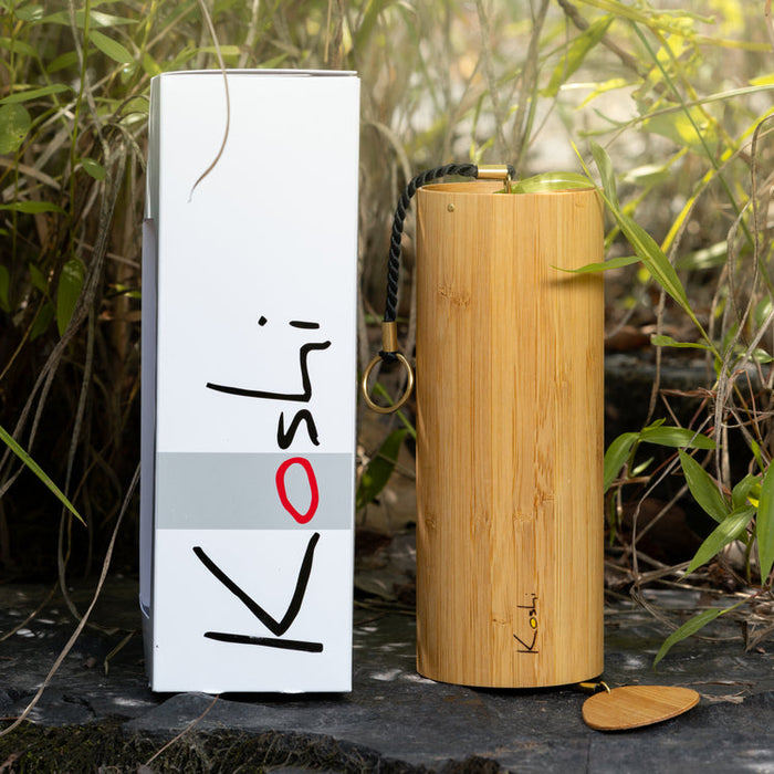 Koshi chime Aria / air with a box on a rock in nature. | weplaywelltogether