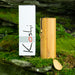 Koshi chime Terra / earth with a box sitting on green ground. | weplaywelltogether