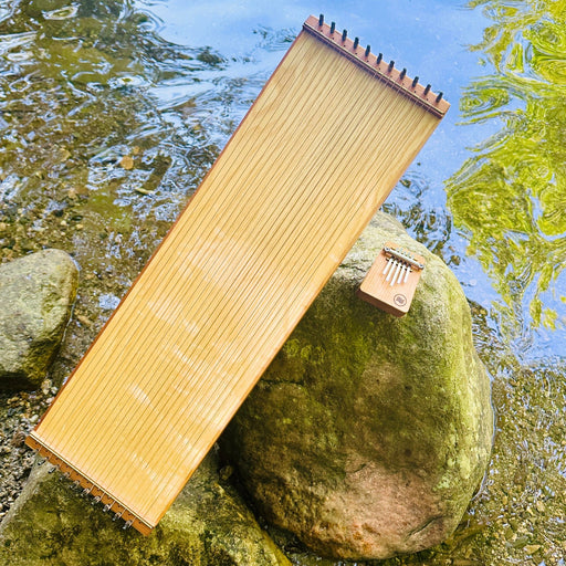 feeltone monolini and Hokema B5 kalimba by the water | Weplaywelltogether