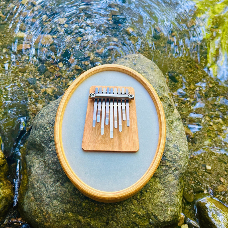 Hokema sansula Renaissance kalimba by the water | weplaywelltogether