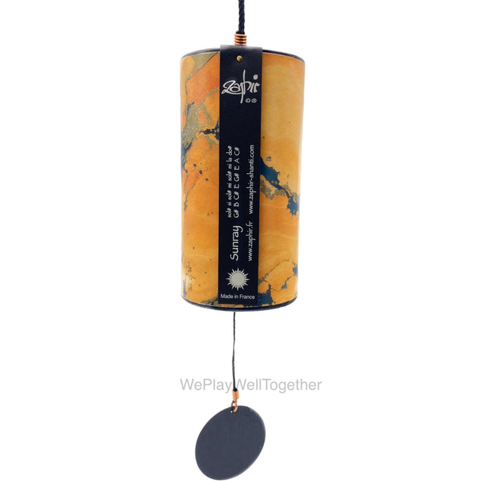 Yellow Sunray Zaphyr chime. The 8 metal cords made out of bronze of different lengths are welded with silver into the metal ring at the base and precise tuning ensures a harmonic interaction of tones and overtones. | weplaywelltogether