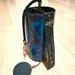 blue colored Zaphir chime sitting on a wooden floor |Weplaywelltogether.
