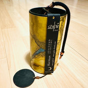 golden colored Zaphir chime sitting on a wooden floor |Weplaywelltogether.
