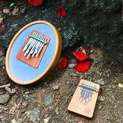 Hokema Sansula Renaissance and B5 Ignis kalimba on ground | weplaywelltogether