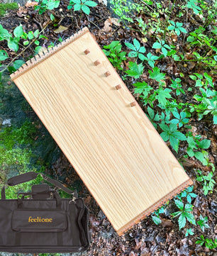 feeltone monochord with bag in nature | weplaywelltogether