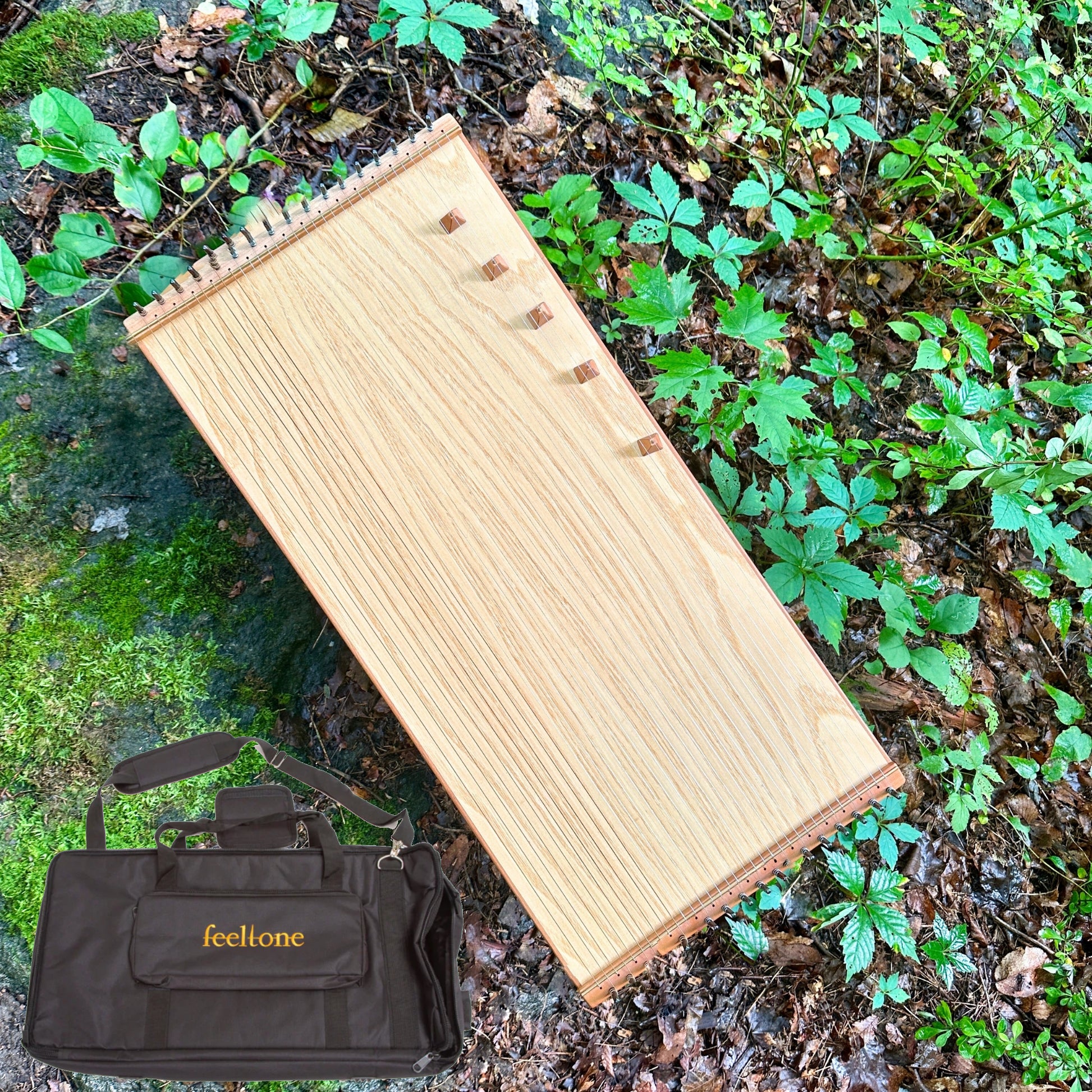 feeltone monochord with bag in nature | weplaywelltogether