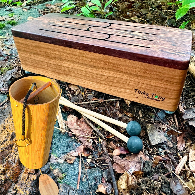 feeltone Tinka Tong wooden tongue drum with mallets and koshi chime in nature | weplaywelltogether