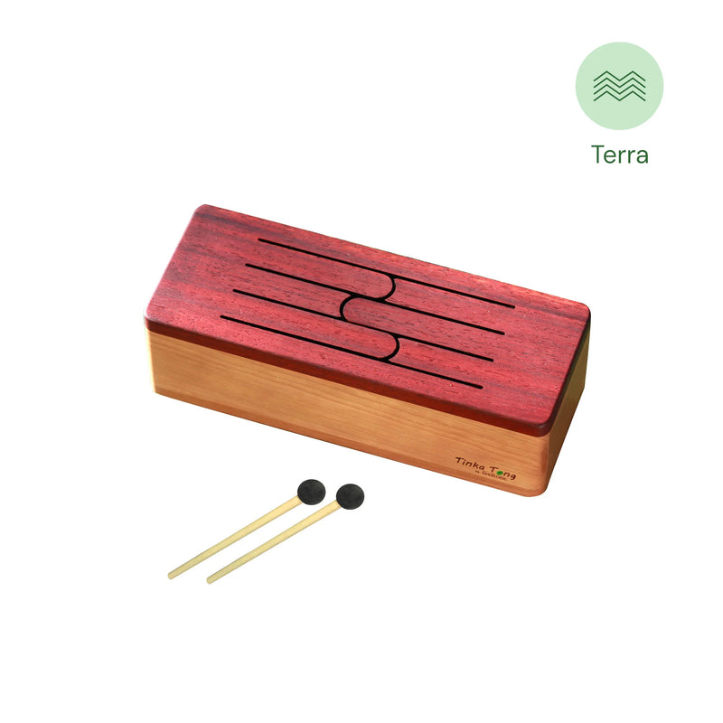 a wooden tongue drum - tinka tong Terra with mallets by feeltone | weplaywelltogether