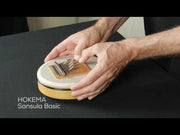 Two hands playing the Sansula Basic from Hokema Kalimbas | Weplaywelltogether